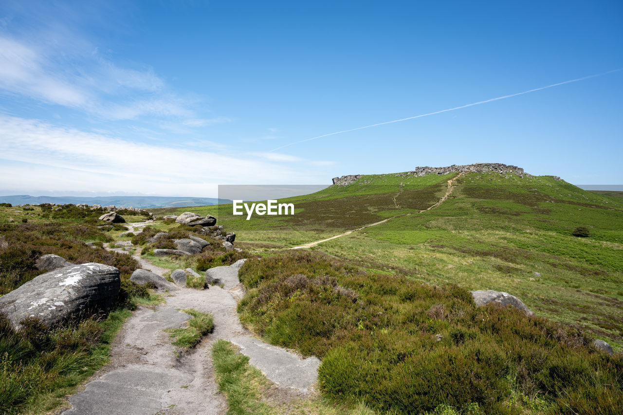 Ancient iron age hill fort carl wark from higger tor in the peak district national park, derbyshire.