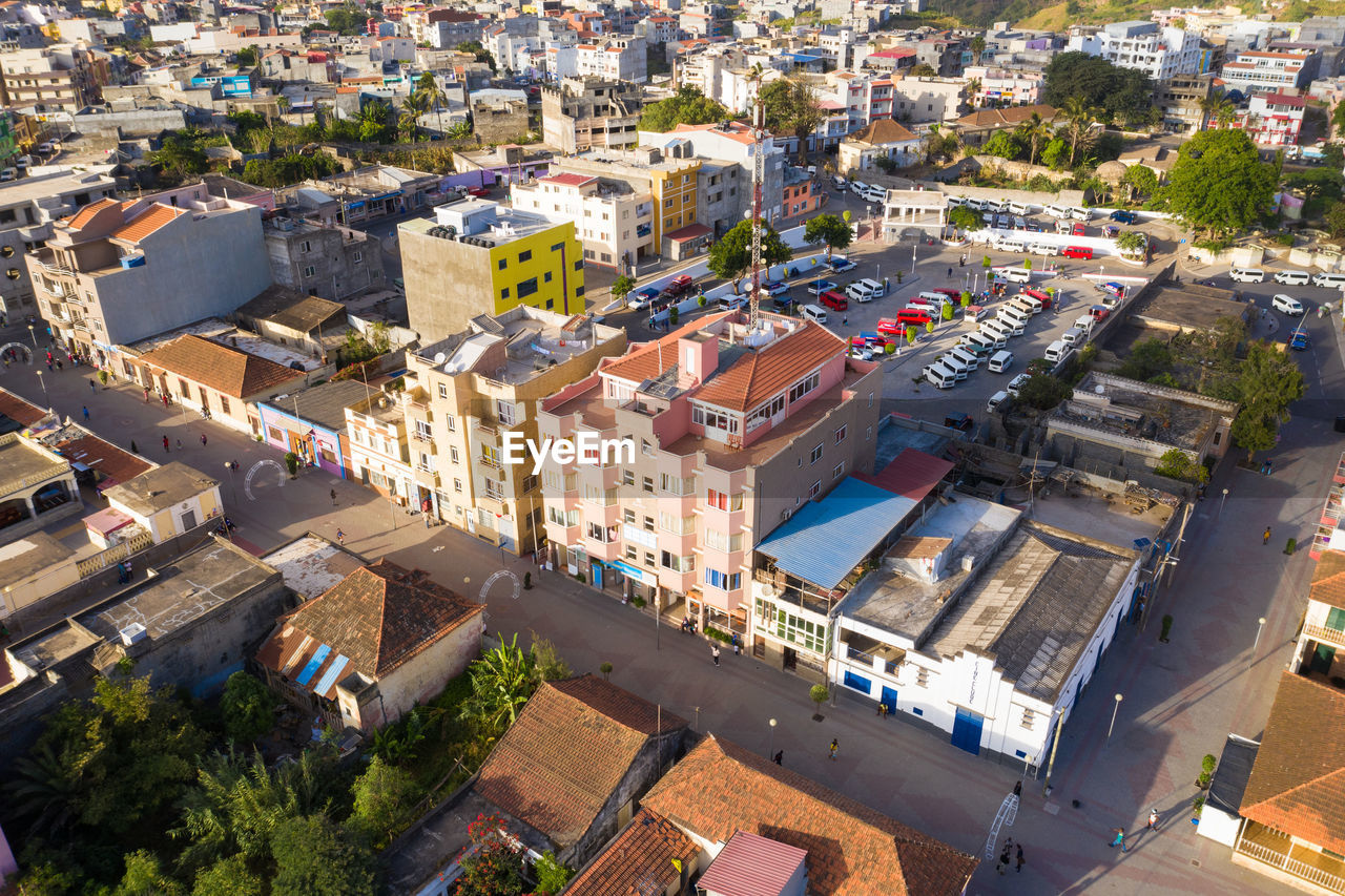 HIGH ANGLE VIEW OF STREET AMIDST HOUSES IN TOWN