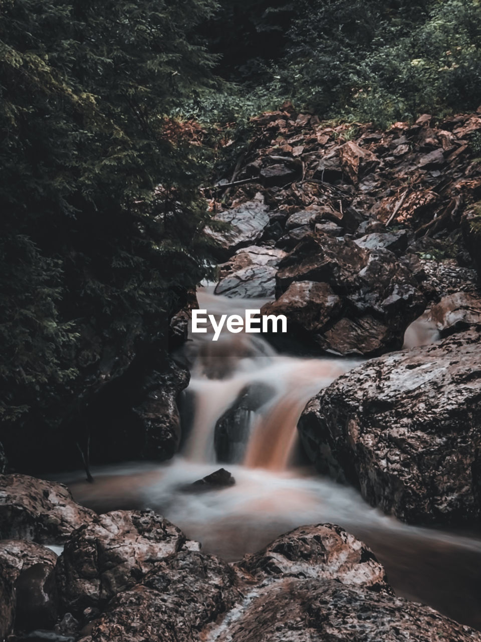 RIVER FLOWING THROUGH ROCKS
