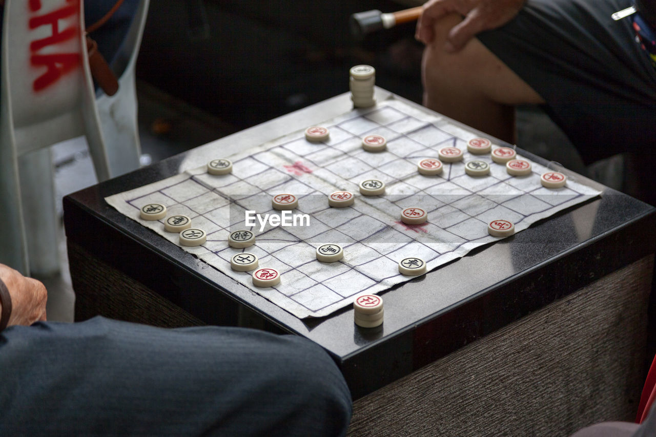 Two old chinese man playing xiangqi, also known as chinese chess or elephant chess.