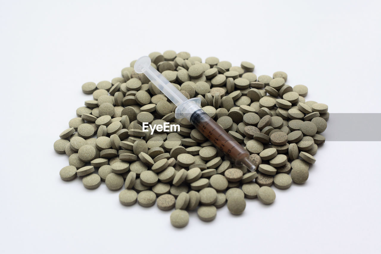 HIGH ANGLE VIEW OF STONES ON WHITE BACKGROUND