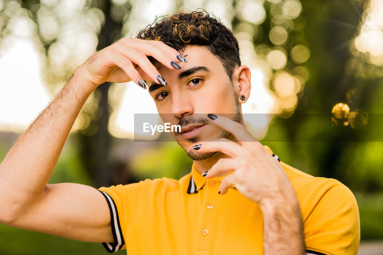 Portrait of young man standing outdoors