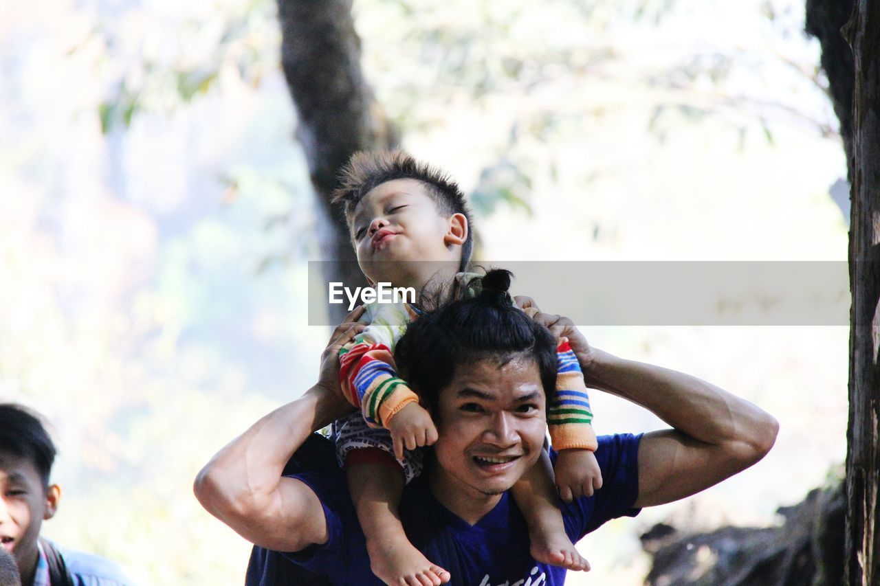 Father and son playing in park