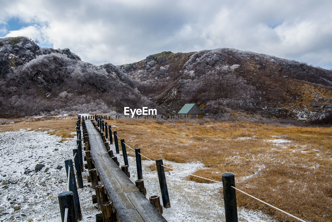 Scenic view of snow mountains against sky
