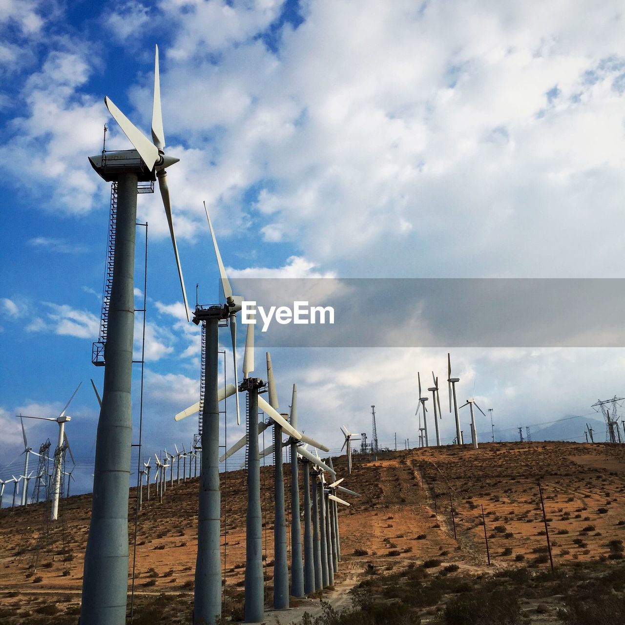 Low angle view of windmill against sky