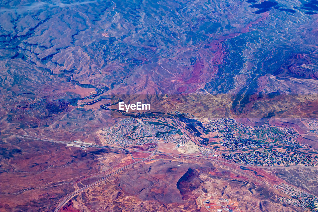 Aerial view of rocky mountains on sunny day