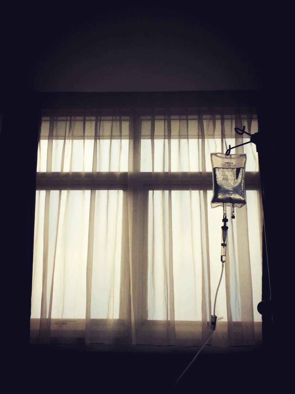 Iv drip by window in hospital