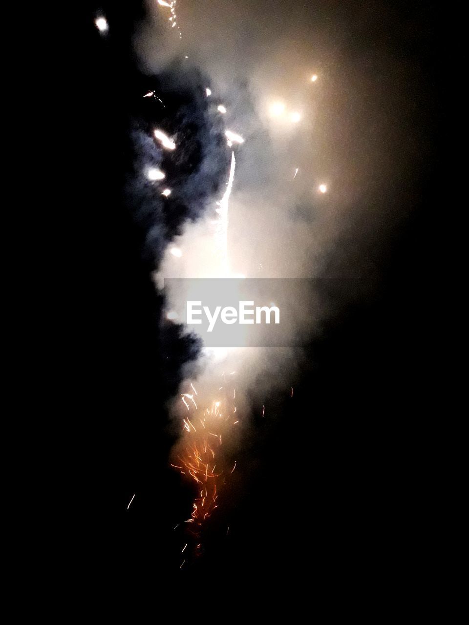 LOW ANGLE VIEW OF FIREWORKS IN SKY AT NIGHT