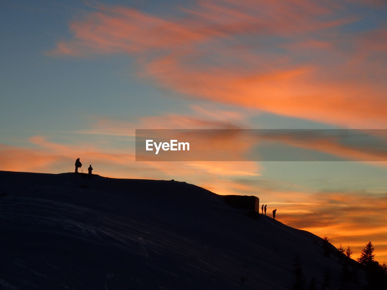 SCENIC VIEW OF SILHOUETTE MOUNTAIN AGAINST ORANGE SKY