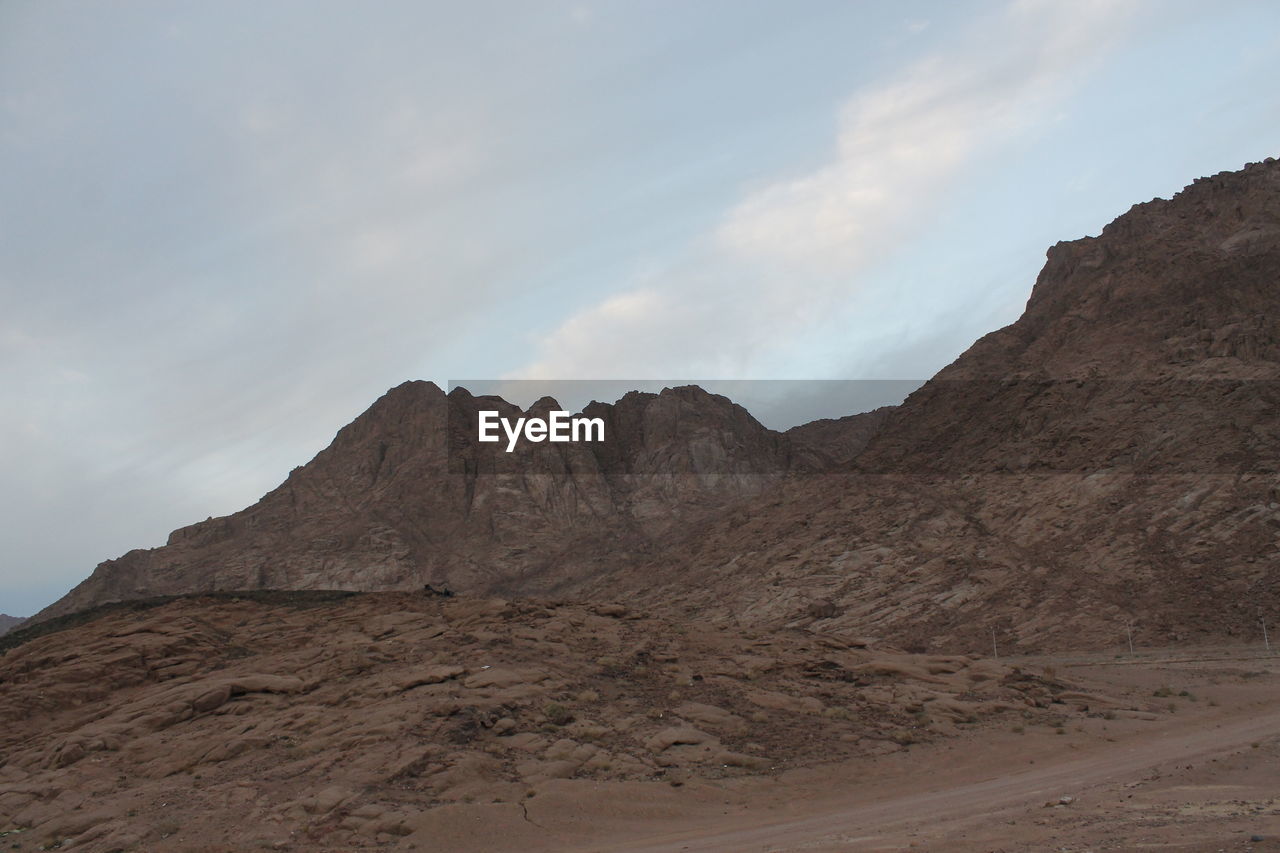 SCENIC VIEW OF ROCK FORMATIONS AGAINST SKY