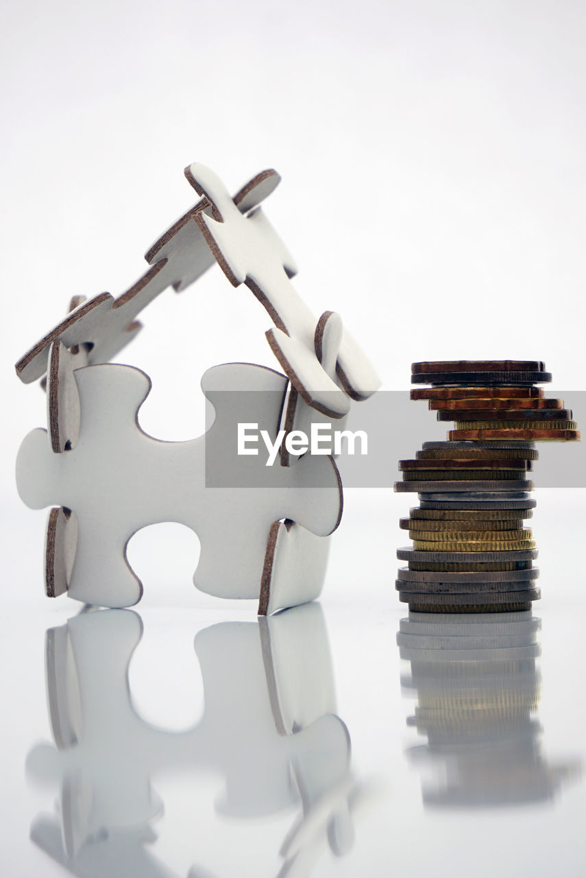 CLOSE-UP OF COIN STACK ON TABLE