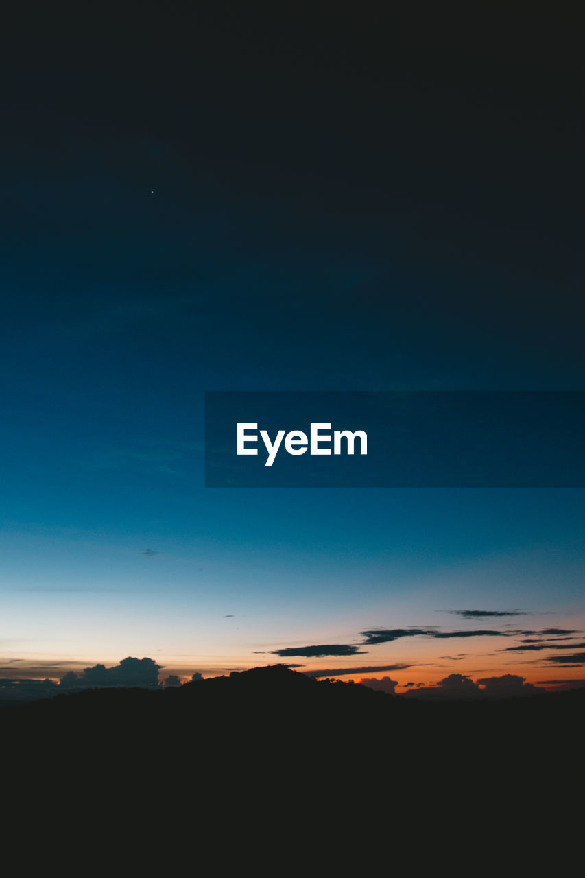 SCENIC VIEW OF SILHOUETTE LANDSCAPE AGAINST SKY AT NIGHT