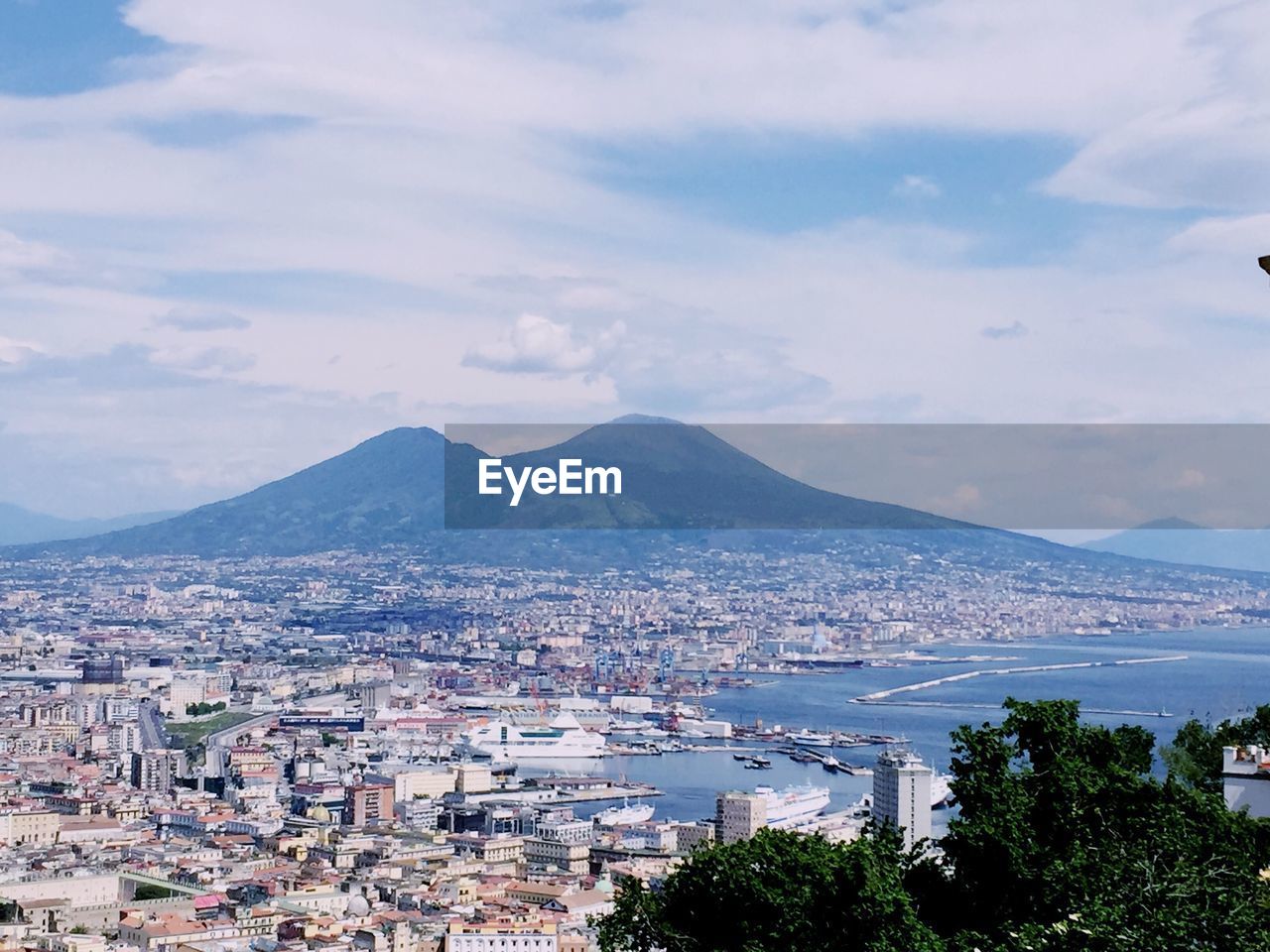 Cityscape with mountain range in background