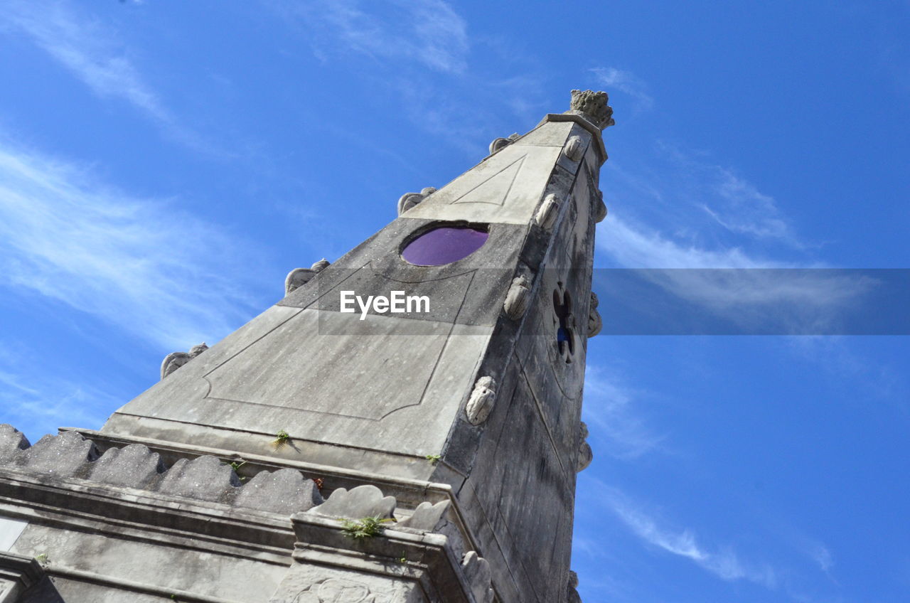 Low angle view of traditional building against blue sky