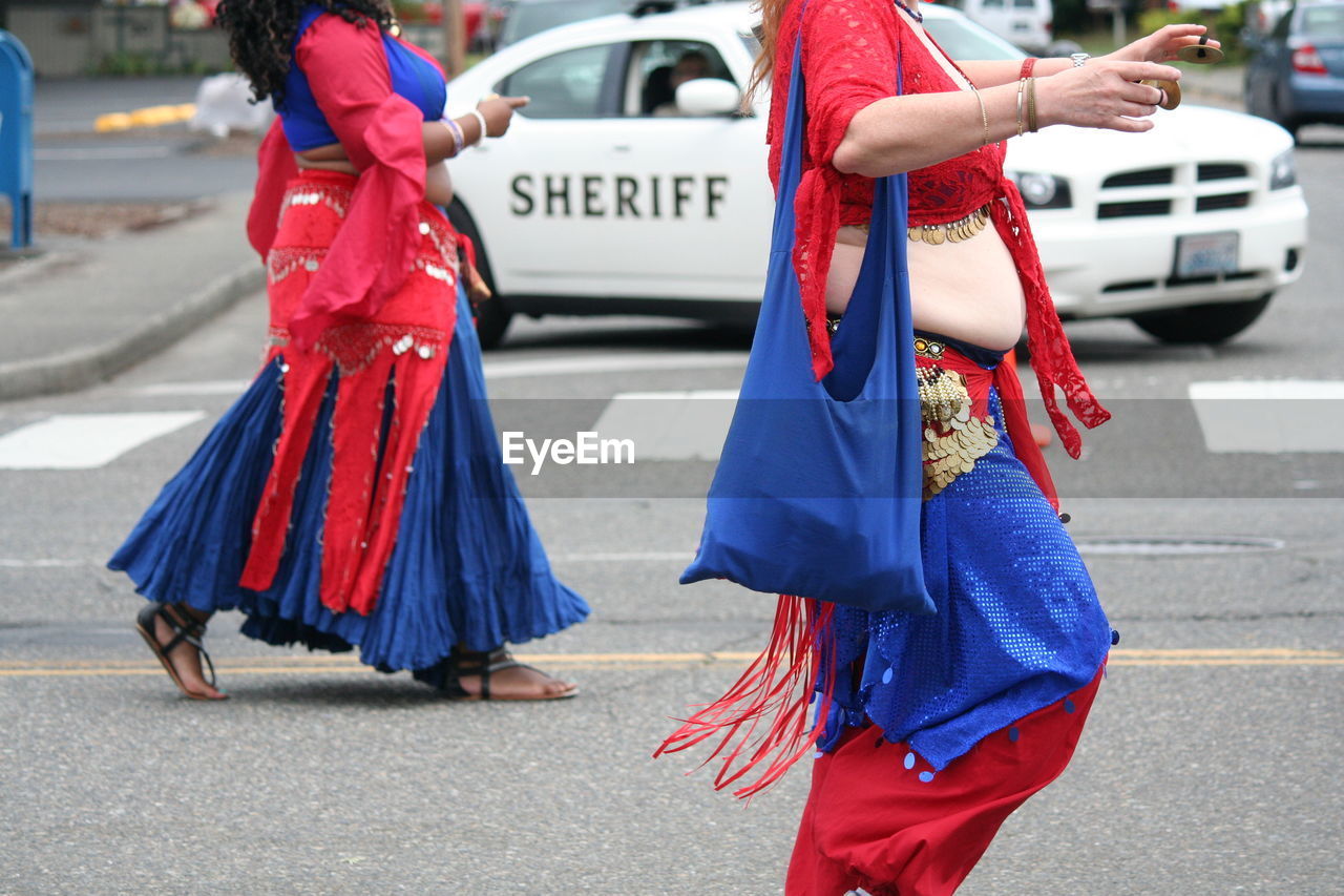 WOMEN STANDING ON ROAD