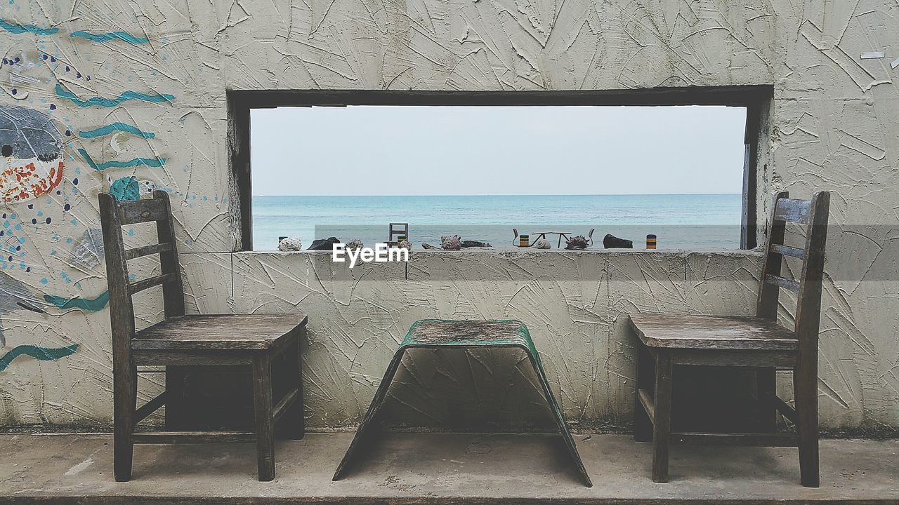 VIEW OF BUILT STRUCTURE WITH SEA IN BACKGROUND