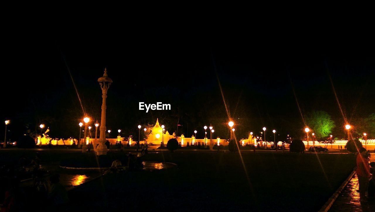 VIEW OF ILLUMINATED STREET LIGHT AT NIGHT