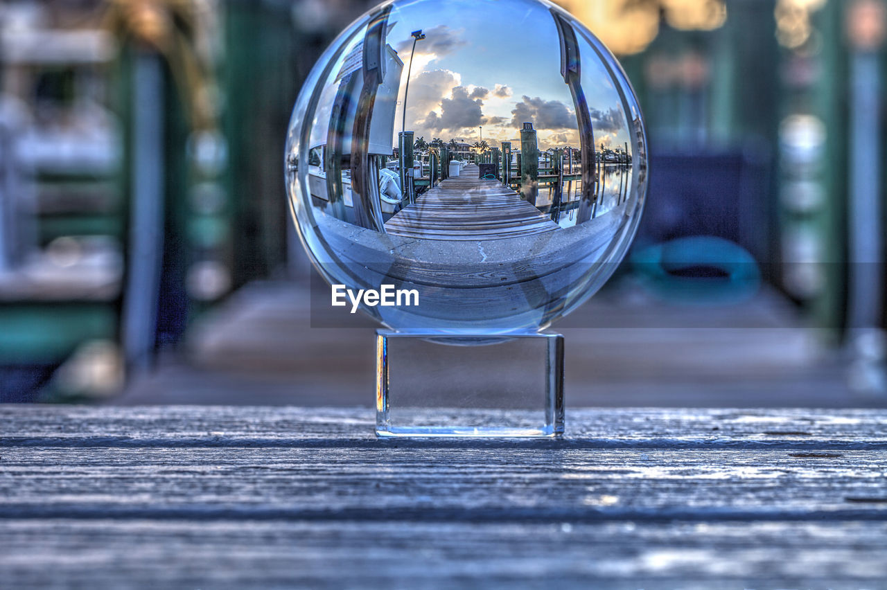 Crystal ball of boats docked at a marina near venetian bay in naples, florida at sunrise.