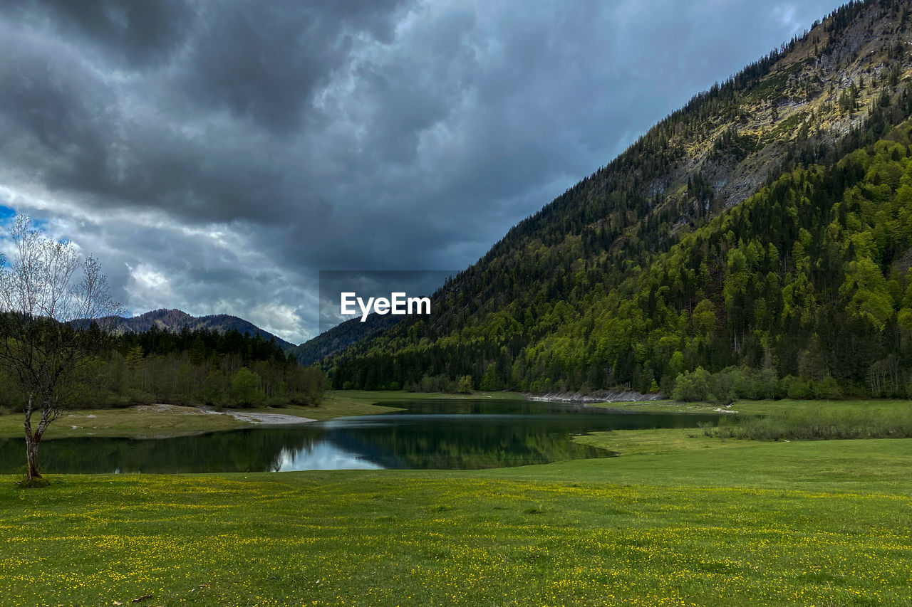 Scenic view of lake lödensee, dreiseengebiet, chiemgau and bavarian mountains against sky