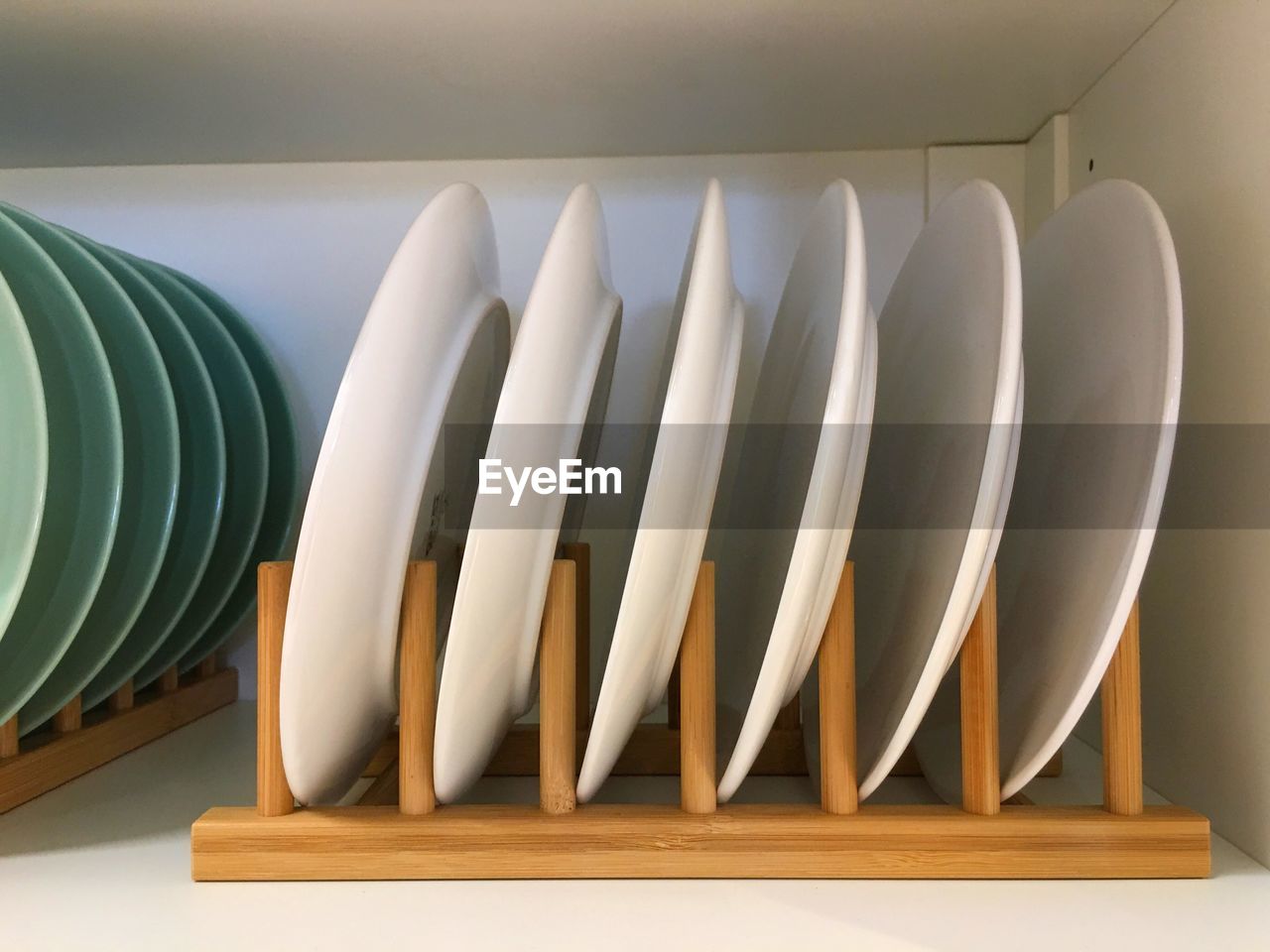 Close-up of white plates on table at home