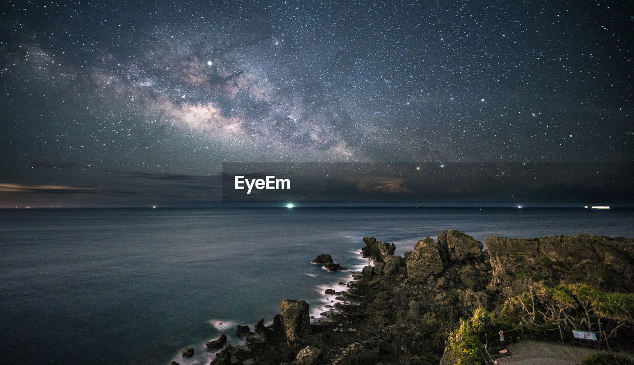 Scenic view of sea against sky at night