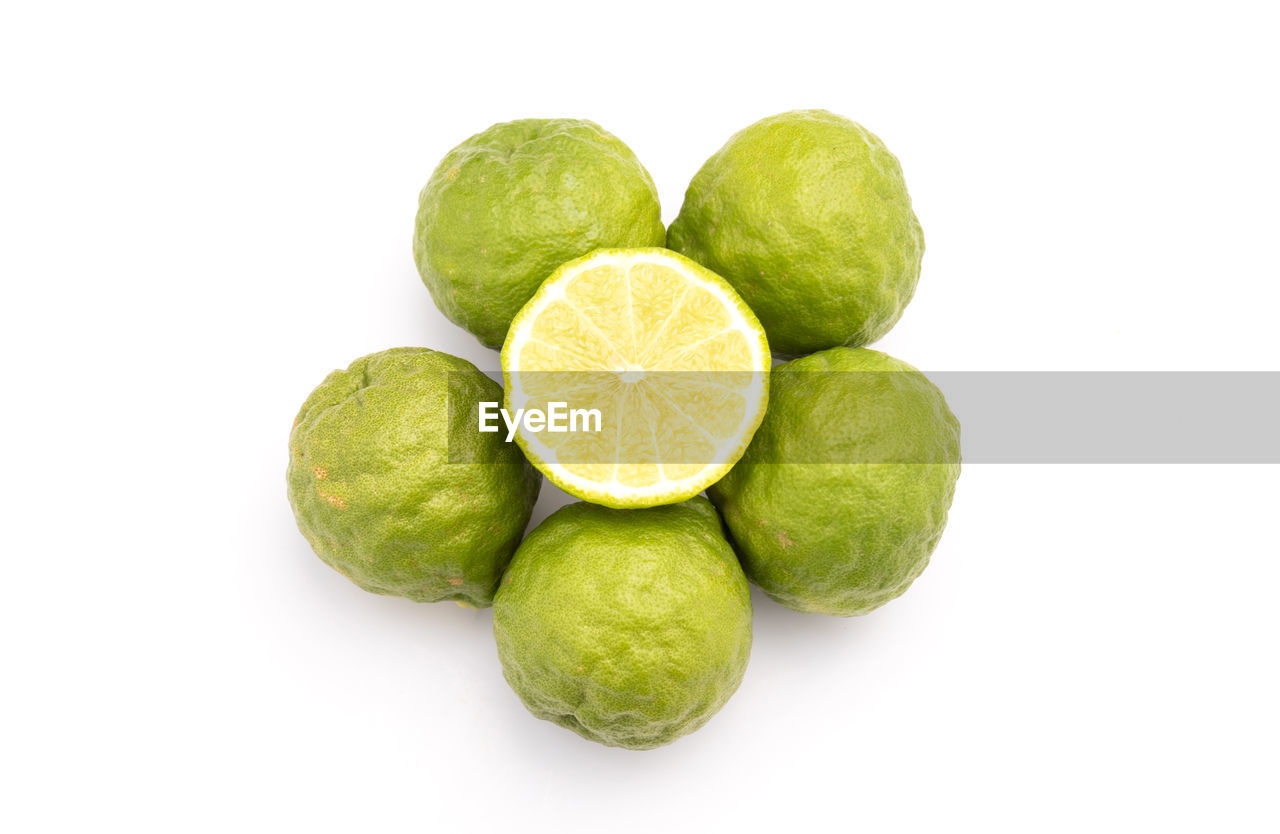 food and drink, food, healthy eating, fruit, lime, freshness, wellbeing, citrus, cut out, plant, produce, white background, studio shot, green, citrus fruit, lemon, indoors, slice, no people, cross section, group of objects, citron, raw food, still life, close-up, group, organic