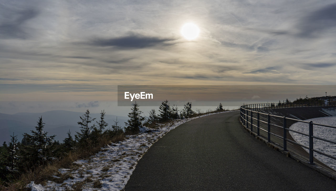 ROAD AGAINST SKY DURING WINTER