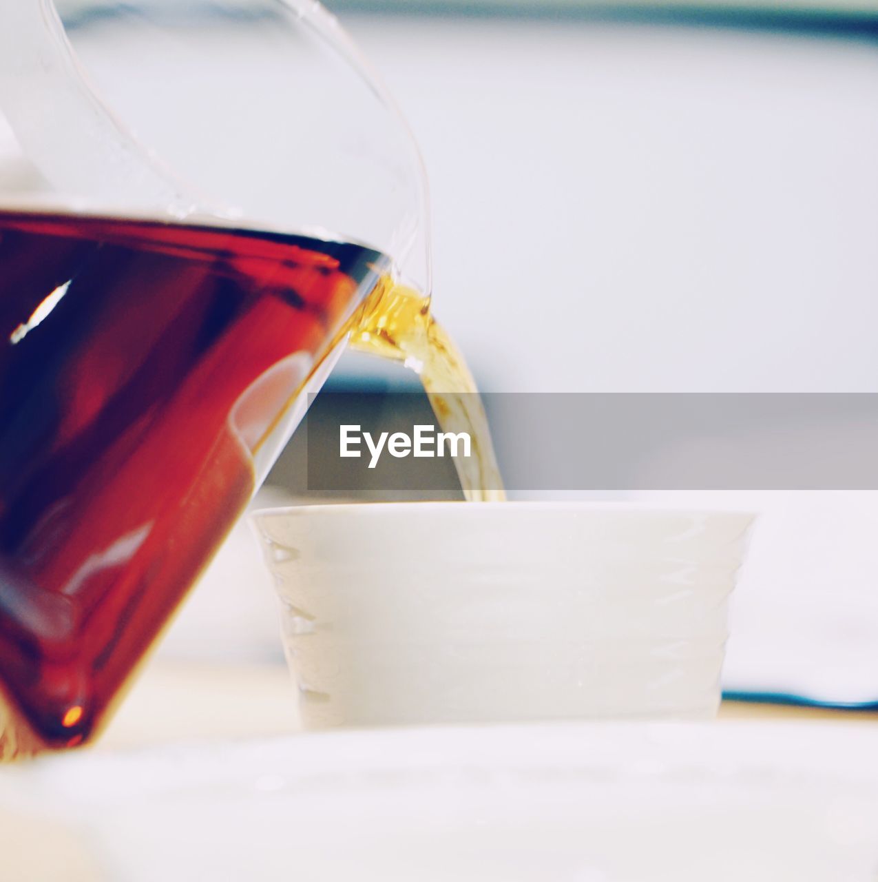 CLOSE-UP OF COFFEE CUP ON TABLE IN CAFE