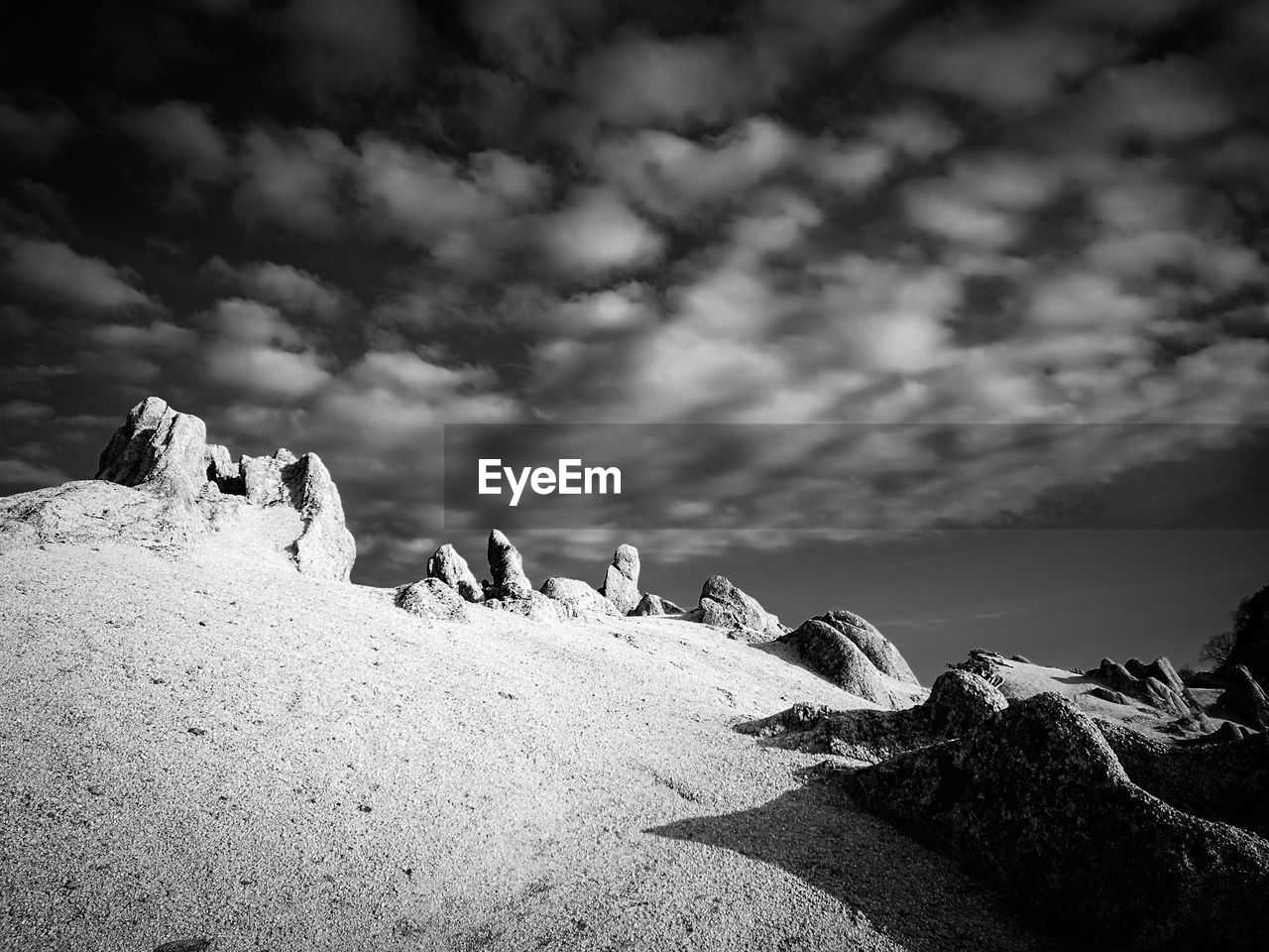 Low angle view of rock formation against sky