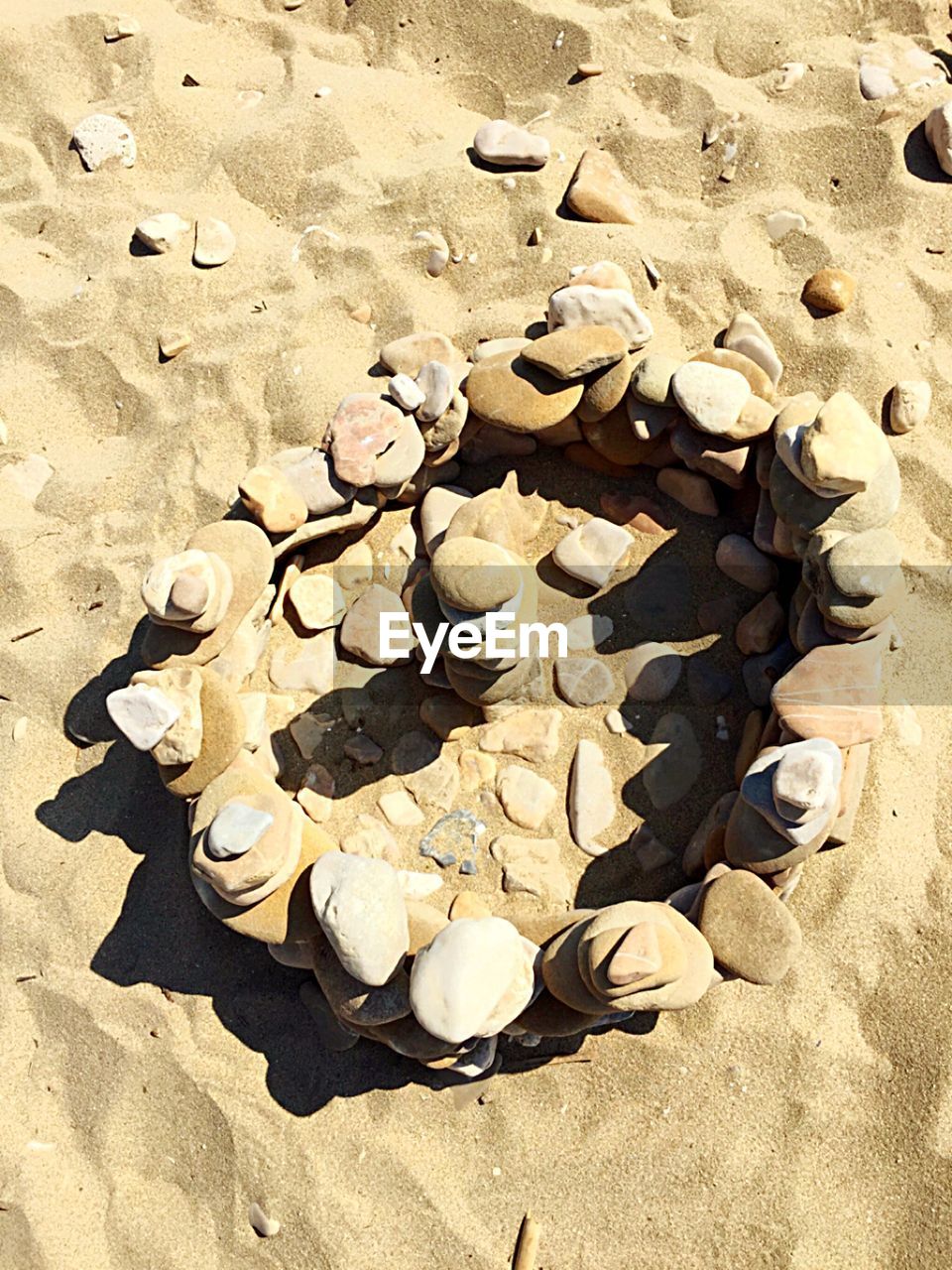 Stack of rocks on sand at beach
