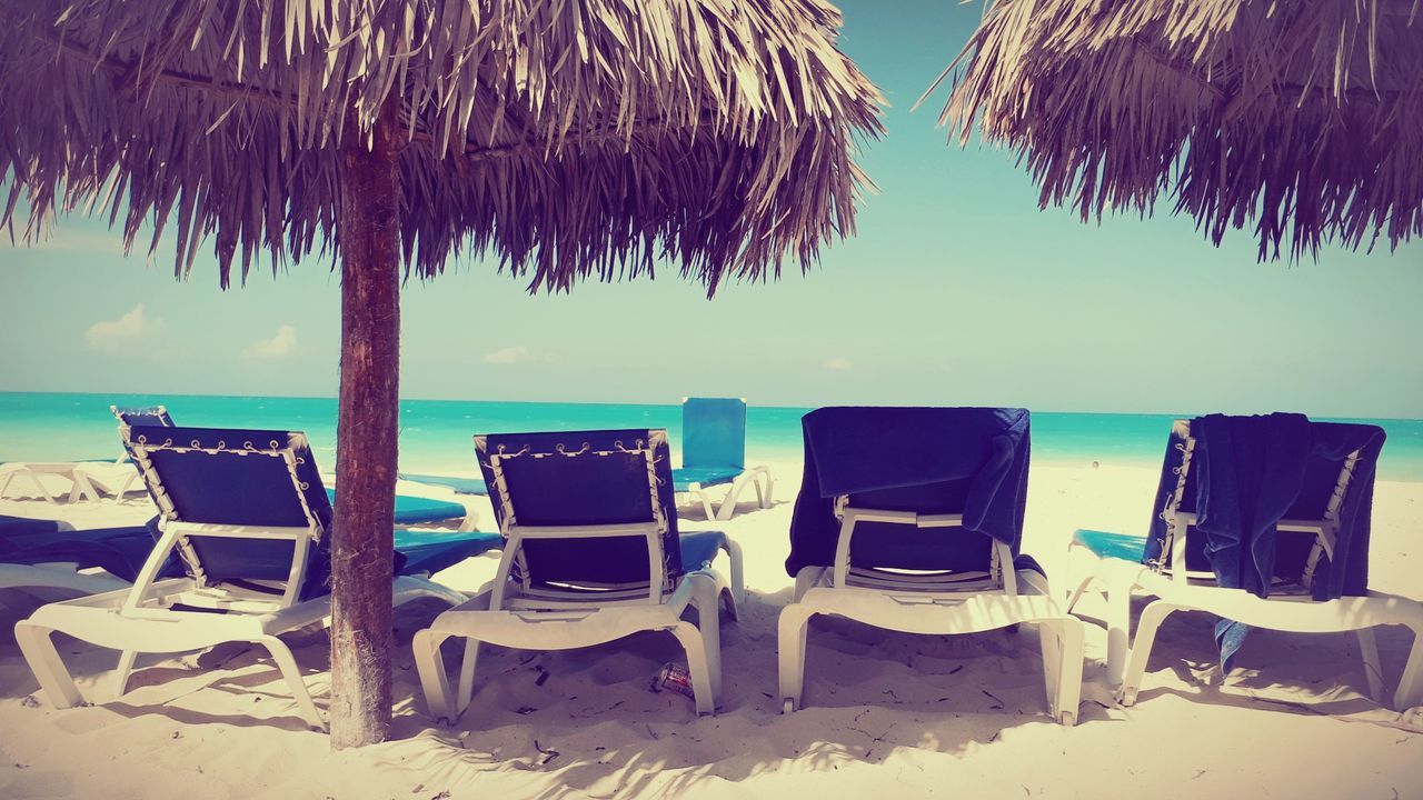 LOUNGE CHAIRS ON BEACH