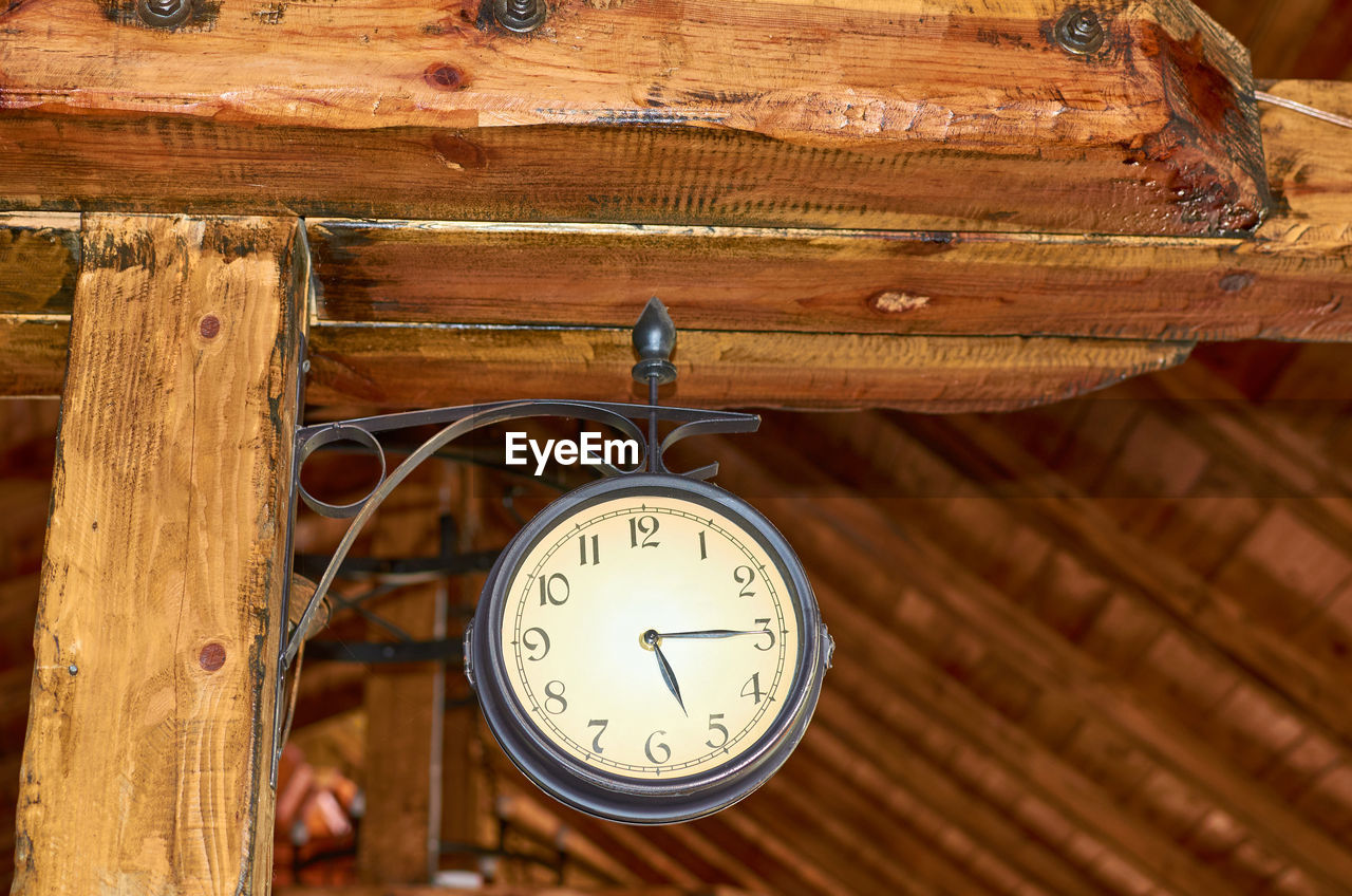 CLOSE-UP OF CLOCK ON ROOF