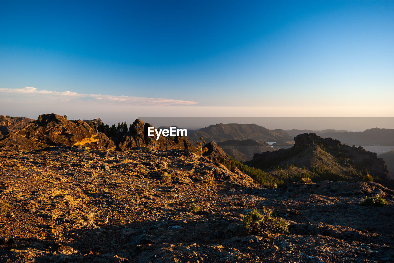 SCENIC VIEW OF MOUNTAIN AGAINST SKY