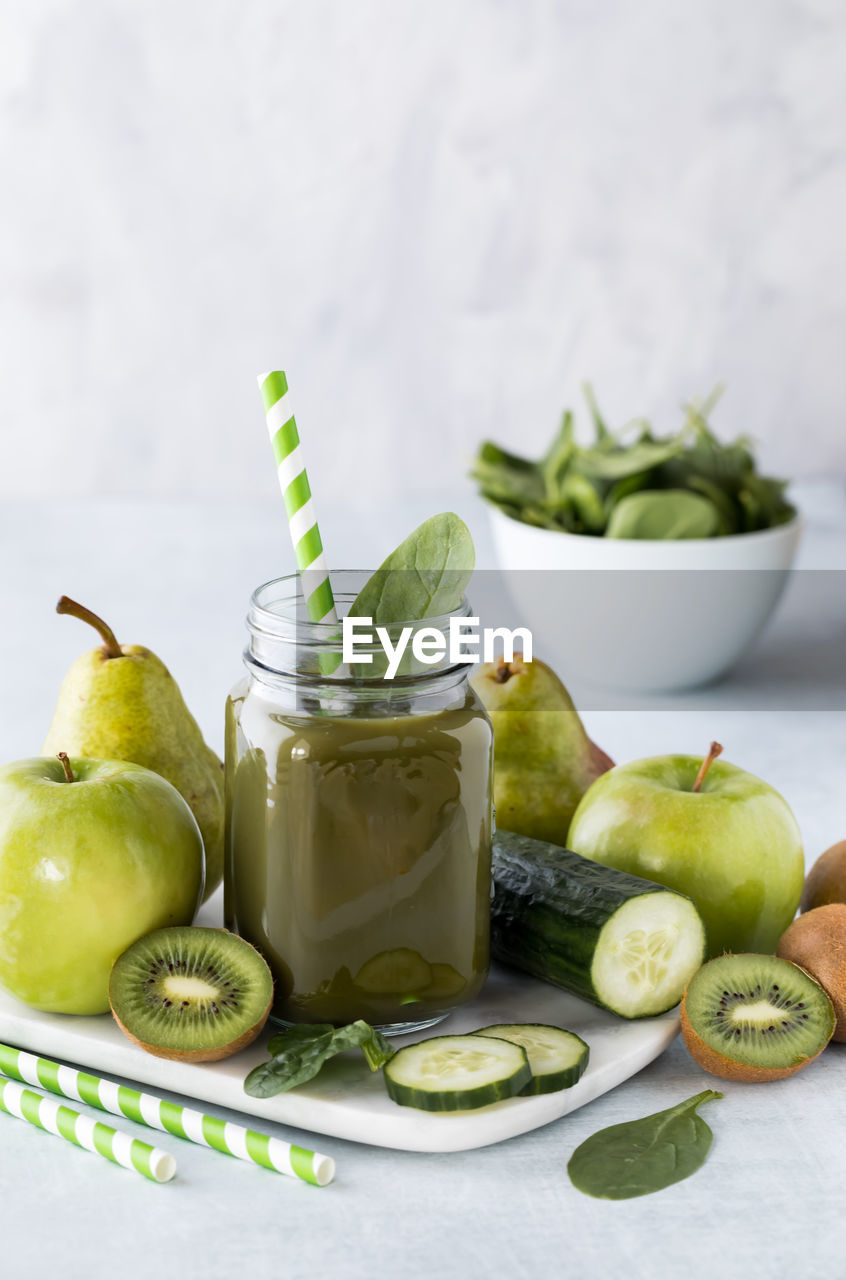 Glass jar of green smoothie.