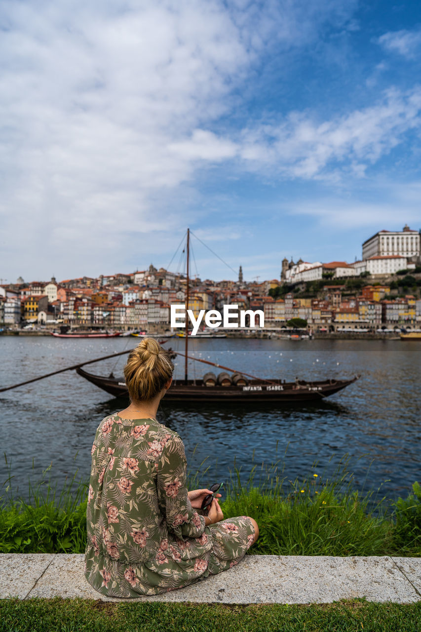 Lady looking a beautiful landscape in porto.