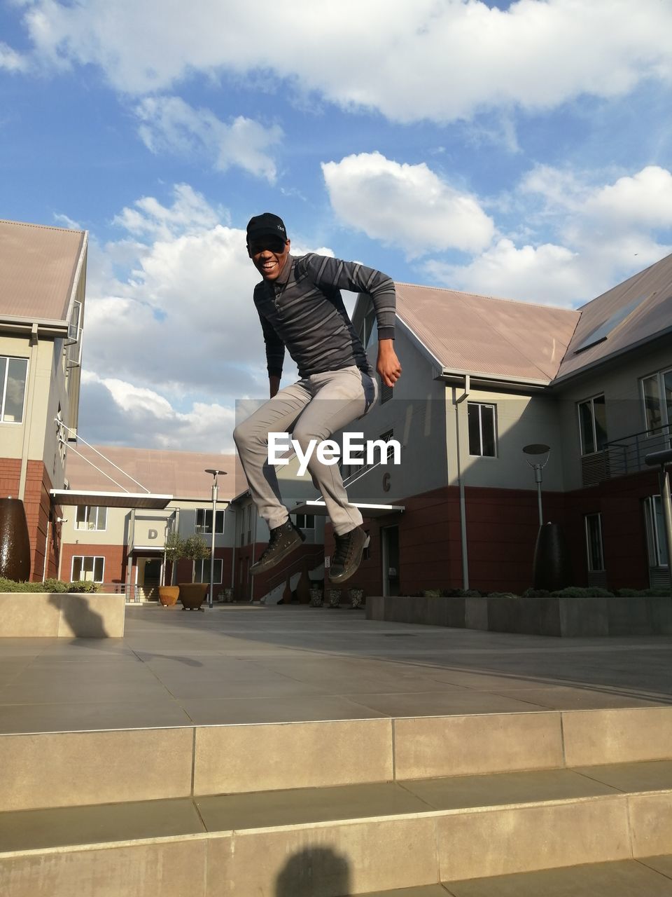 Man building against sky in city