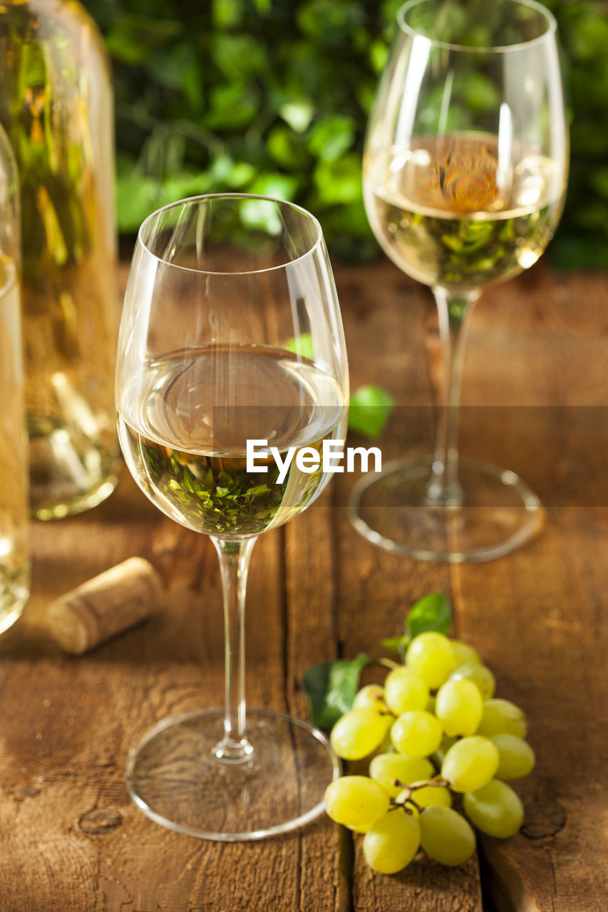 close-up of wine glasses on table