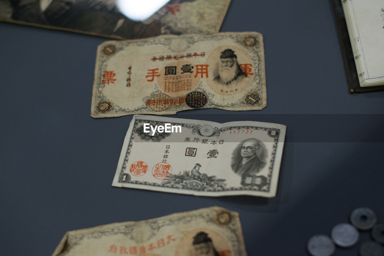 Close-up of paper currency on table