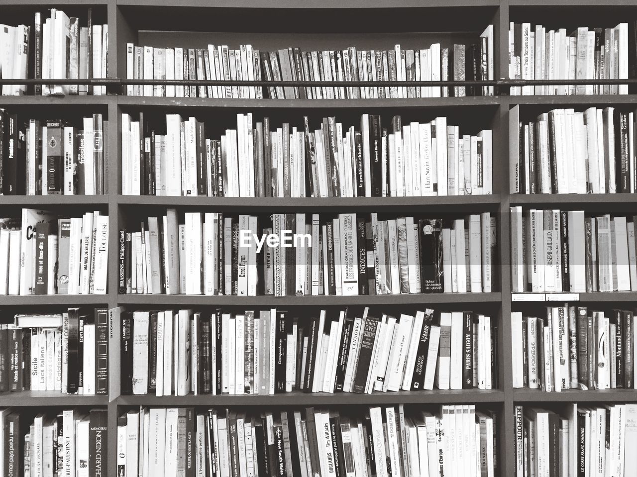 Full frame shot of books arranged in shelf in library