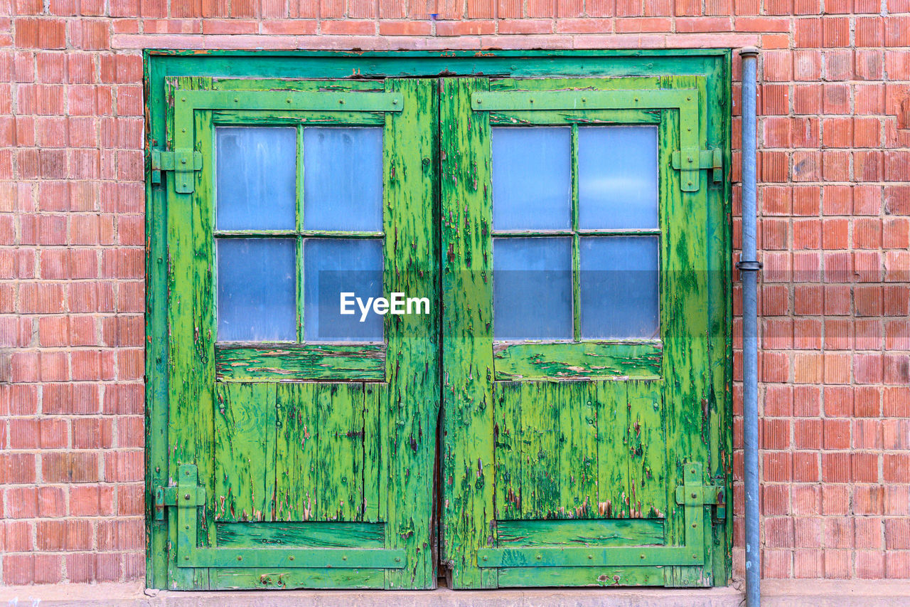 CLOSED DOOR OF WINDOW OF HOUSE