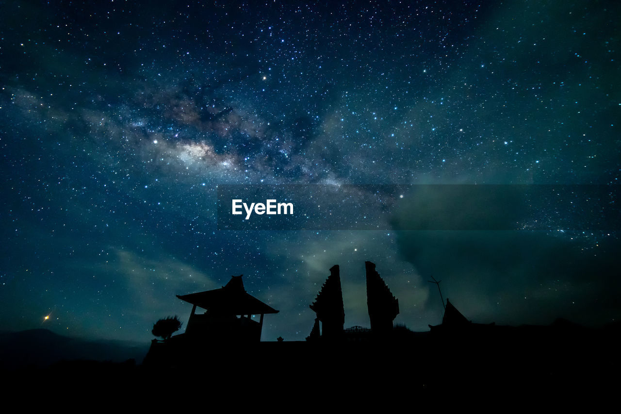 Low angle view of stars glowing in sky