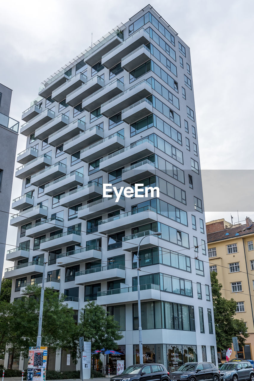 LOW ANGLE VIEW OF MODERN BUILDINGS AGAINST SKY