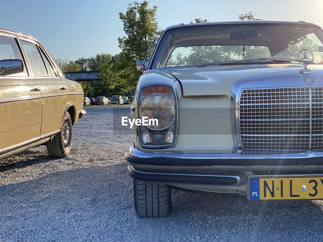 car, vehicle, mode of transportation, transportation, motor vehicle, land vehicle, luxury vehicle, retro styled, automotive exterior, antique car, vintage car, headlight, sky, day, road, nature, blue, compact car, sunlight, no people, clear sky, outdoors