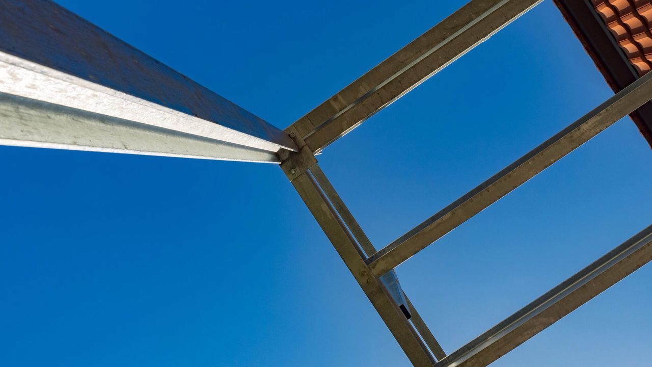 Low angle view of built structure against clear blue sky