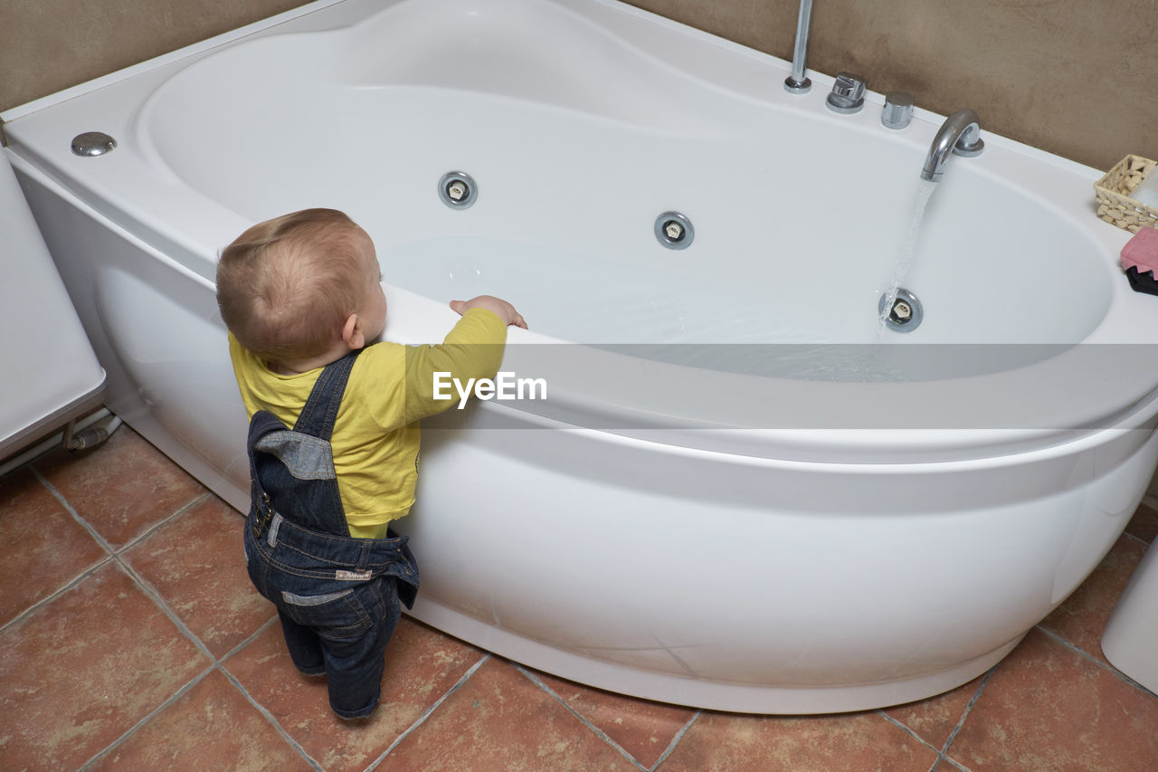 High angle view of boy in bathroom at home