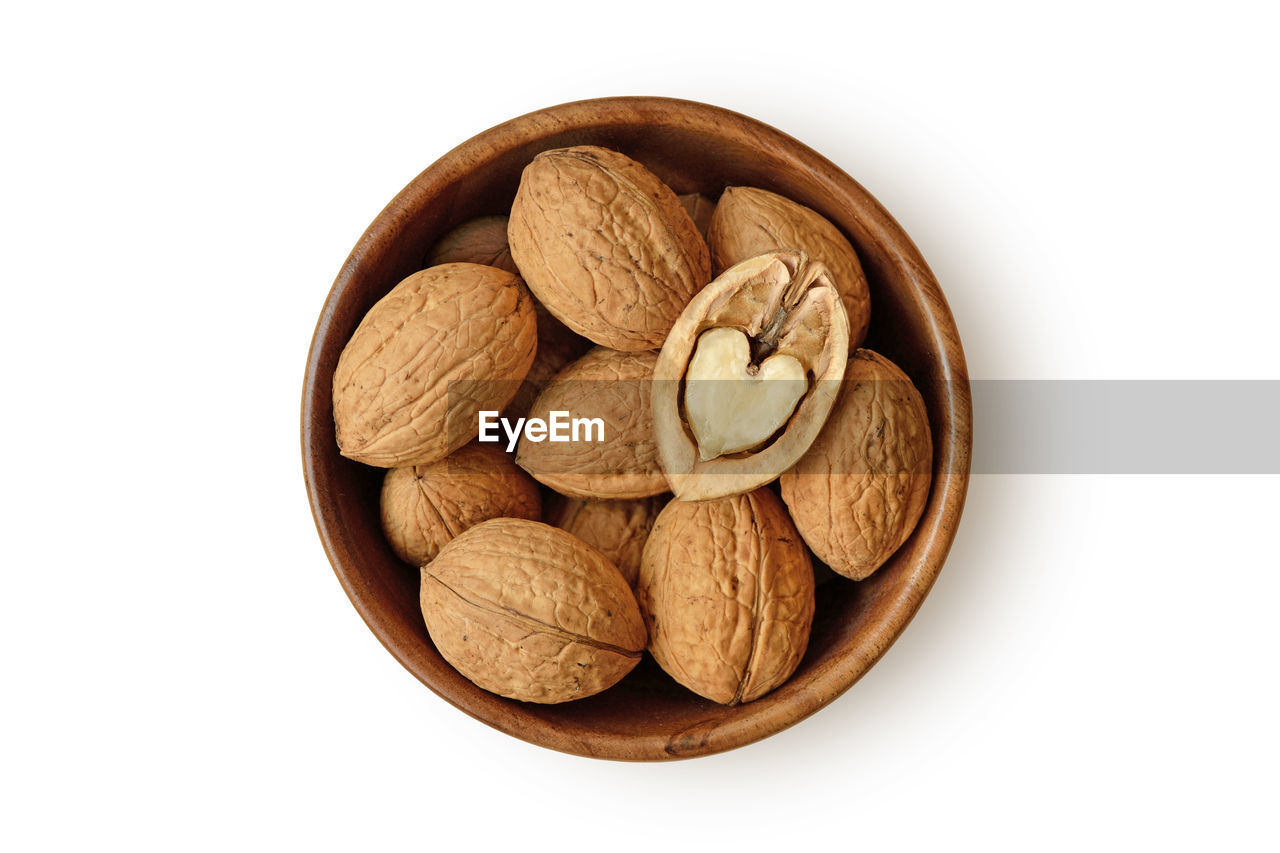 food and drink, nuts & seeds, food, plant, white background, produce, wellbeing, nut, nut - food, healthy eating, cut out, almond, studio shot, indoors, freshness, fruit, brown, no people, large group of objects, still life, directly above, close-up, bowl, dried food, dried fruit