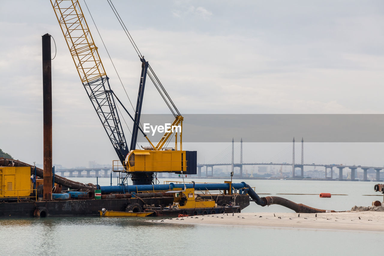 CRANE AT CONSTRUCTION SITE