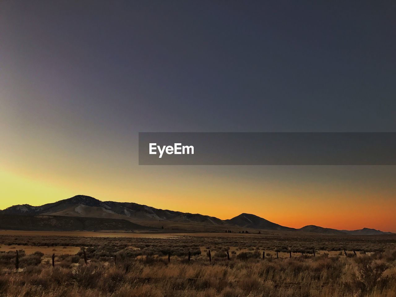 Scenic view of landscape against sky during sunset