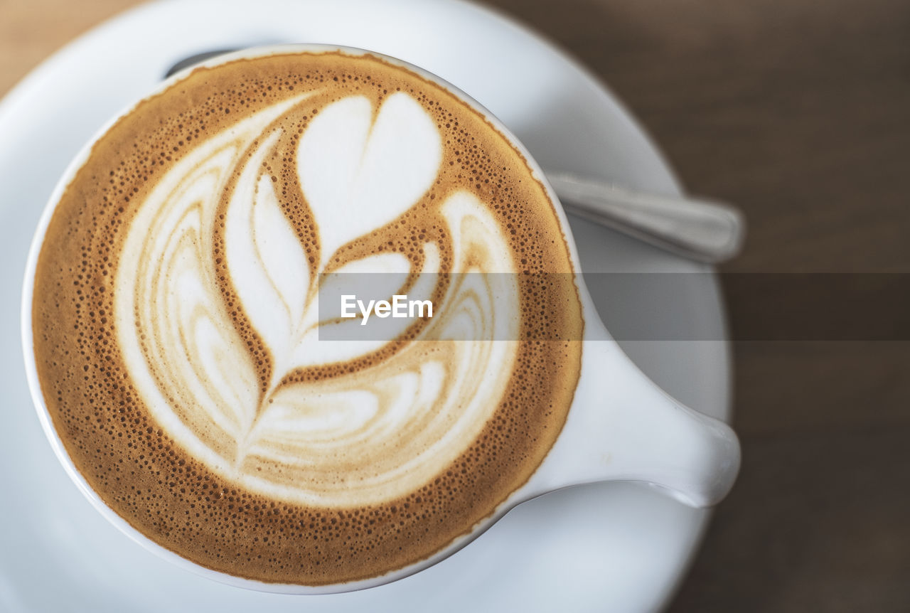 Directly above shot of coffee in cup on table