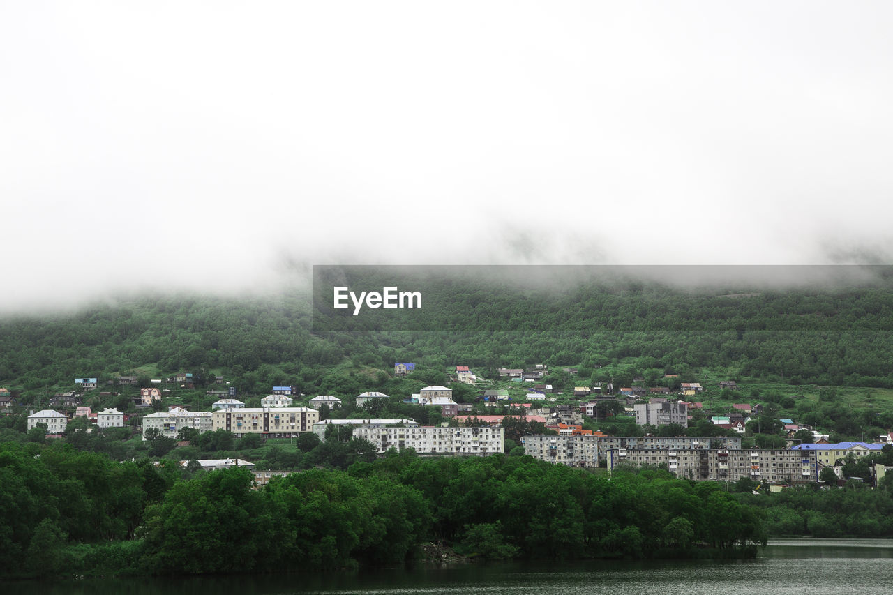 Buildings in city against sky